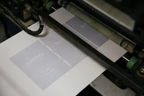 Wine bottles being labeled on automated bottling line machinery